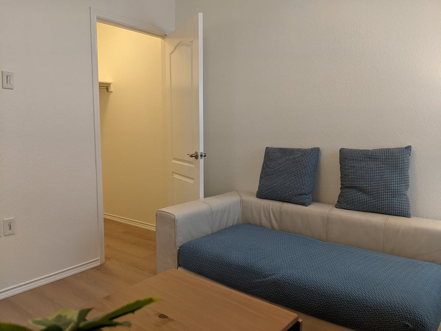 There is a big closet in living room where you can store all your belongings.