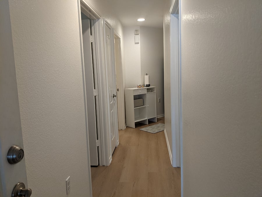 Hallway where a food preparation nook is set up for your convenience.