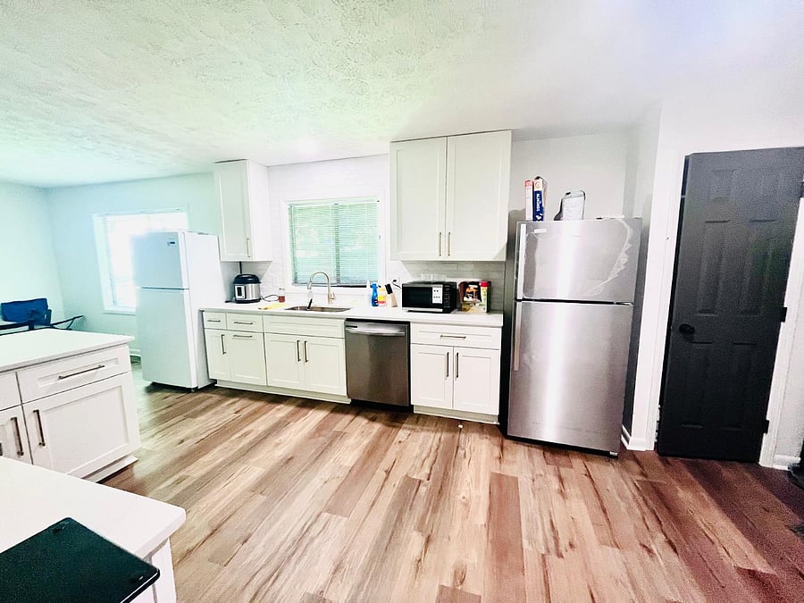 A spacious kitchen with two Fridges