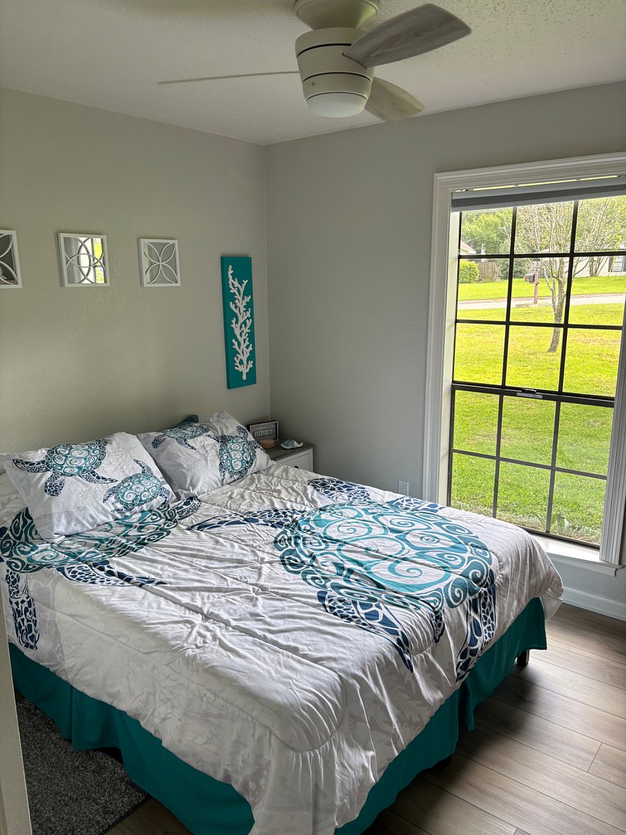Queen size memory foam bed in bedroom #2 with ceiling fan.