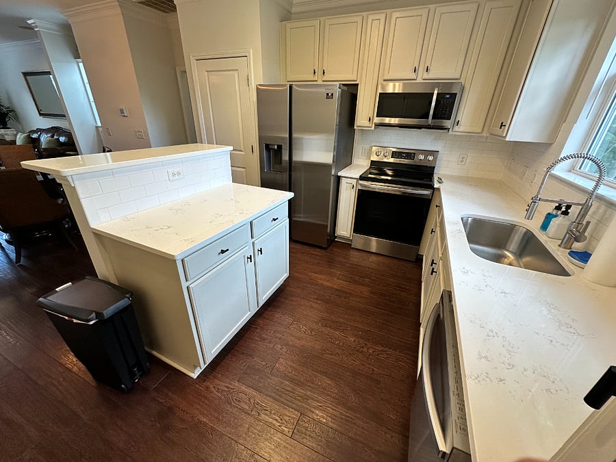Spacious kitchen with new stainless steel Samsung appliances.