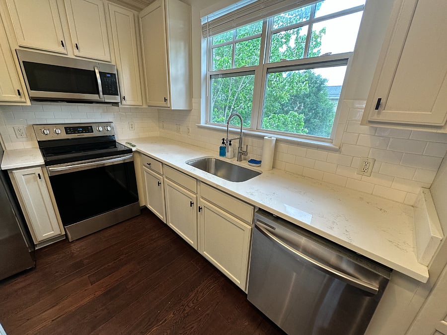Granite countertops, dishwasher, spacious kitchen.