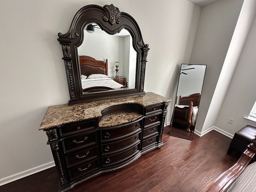 Unique and spacious genuine marble top dresser in main bedroom.