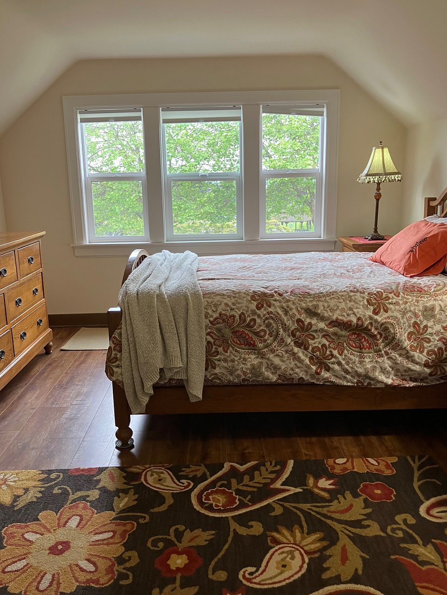 Queen size bed with enormous dresser.  Both offer plenty of room for two