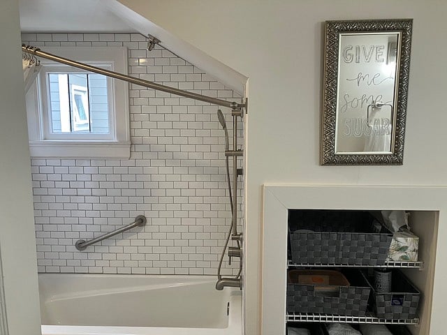 Shower curtain rod adapted to roof line. Plenty of storage baskets.