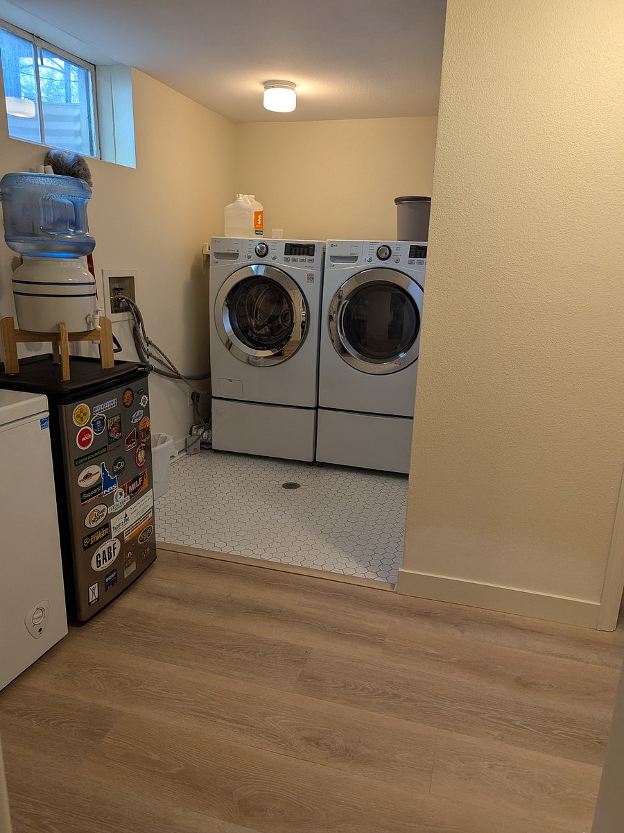 Laundry room, which you will walk through to get to the corner bedroom and the basement bathroom.
