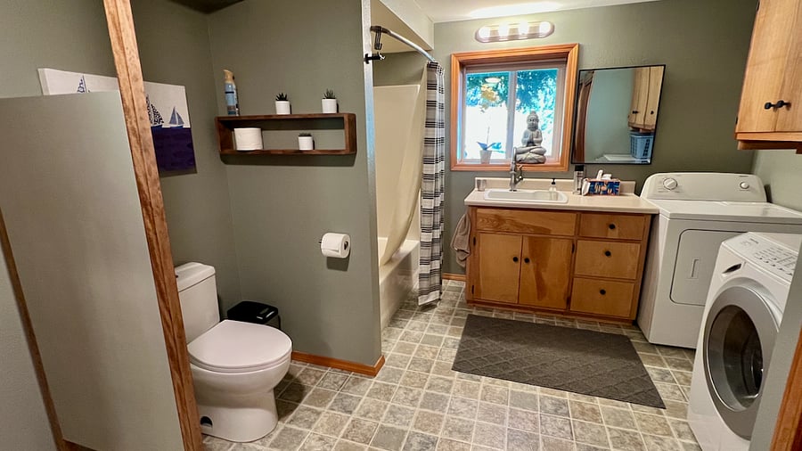 Downstairs full bath and laundry, large closet and storage