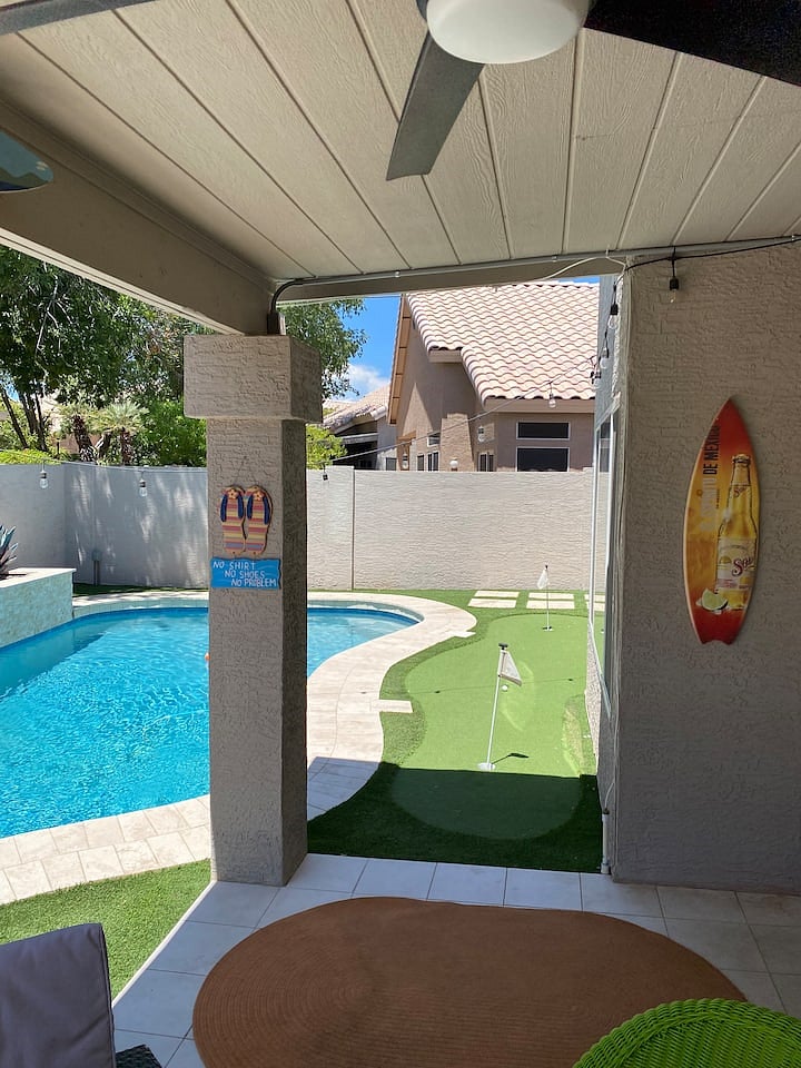 View of putting green and pool from patio.