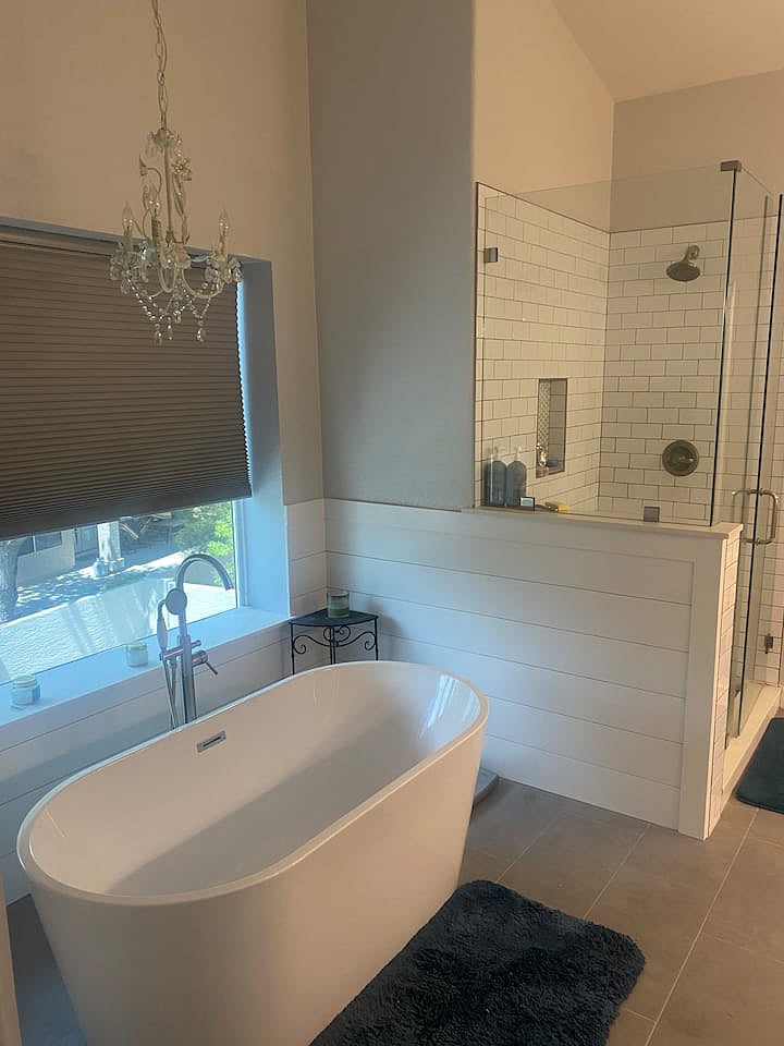 Master bathroom off master bedroom with soaking tub and separate shower.