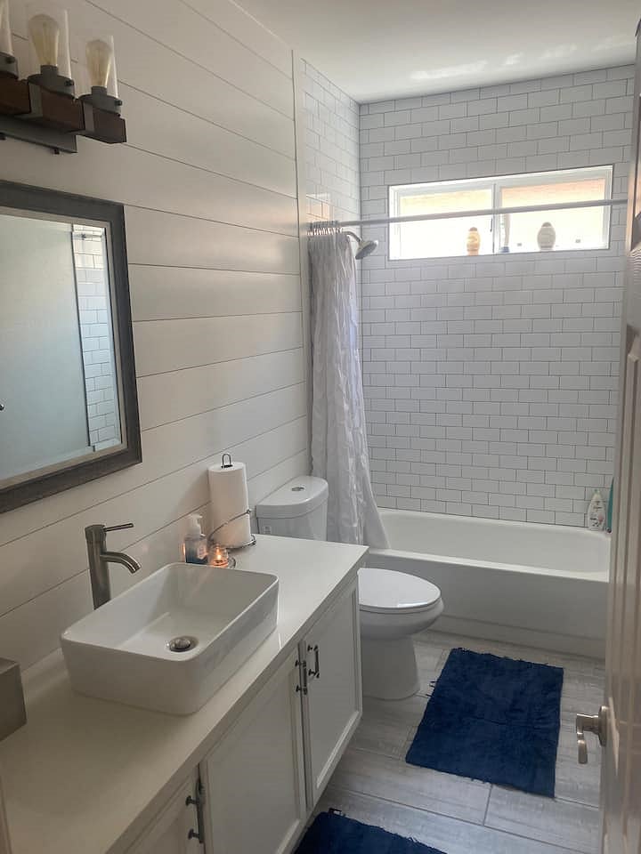 Main floor full bathroom located near main floor bedroom.