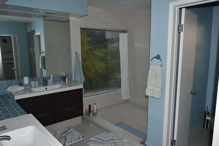 Master Bathroom Roman Tub, Dual sinks, Enclosed toilet with bidet, drawers and vanity with stool, mirror and all bathroom amenities including first aid kit, shampoo, body gel, solid water pressure. Curtains on window for privacy, or keep open for canyon views with flowering.fruting pomegranate trees. 