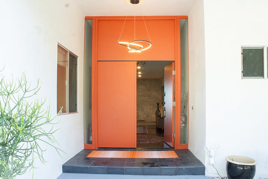Double door entry with pin pad and deadbolt, camera inside will notify you when there is a person or package at door.