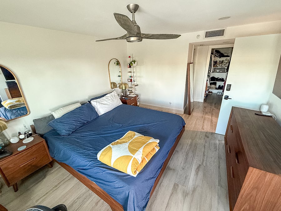 Spacious master suite with king bed, walk-in closet, and dedicated office space.