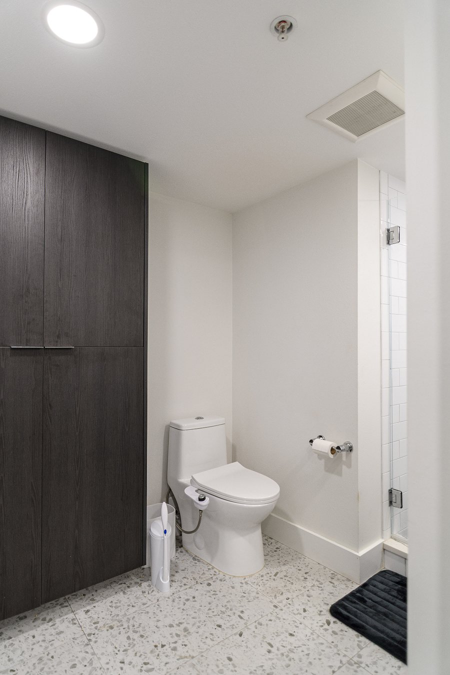 Low-flow plumbing and ample storage for towels, toiletries, and beach supplies.