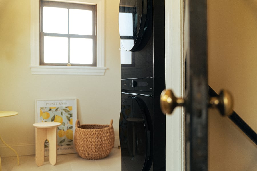Stacked washer and dryer with the sweetest little coffee nookperfect for easing into your morning routine.