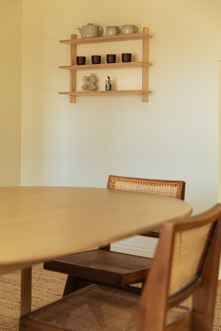 white oak dining table with beautiful chairs