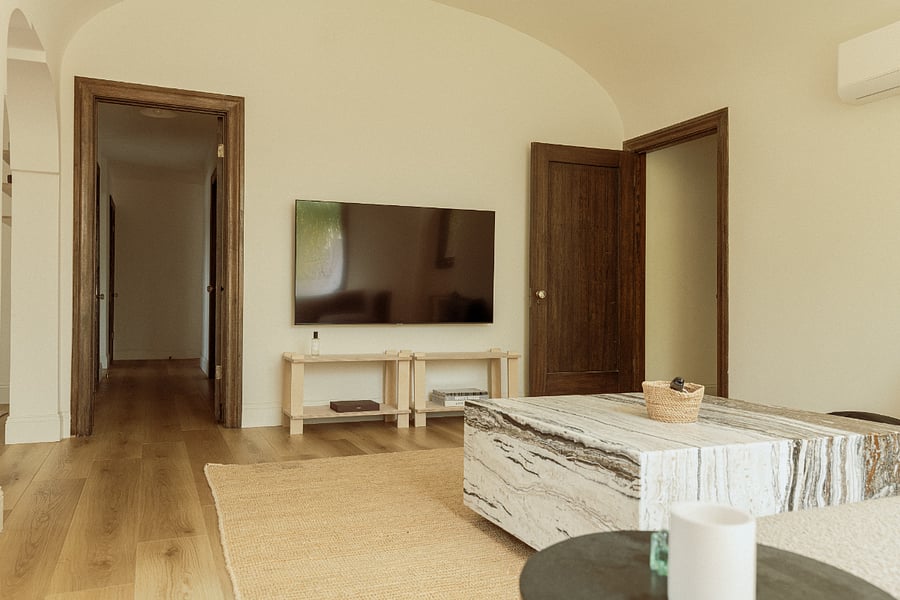 Our living room is the true star of the home. With soaring high ceilings, beautiful oak flooring, and an abundance of natural light, it's the perfect place to start your morning and enjoy the warmth and charm of the space.
