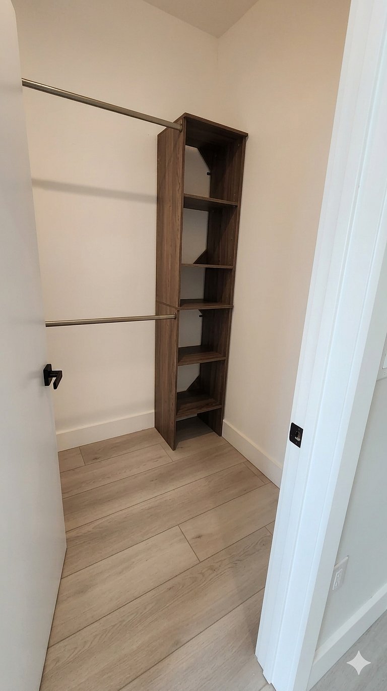 Closet  Spacious closet with convenient storage and organized shelving space.