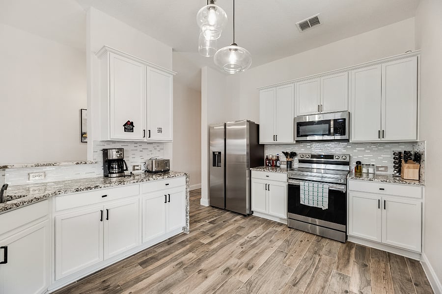 Cook with ease in our fully stocked kitchen featuring all utensils, coffee maker, blender, rice maker, toaster, and a spacious fridge with extra ice trays for gatherings.