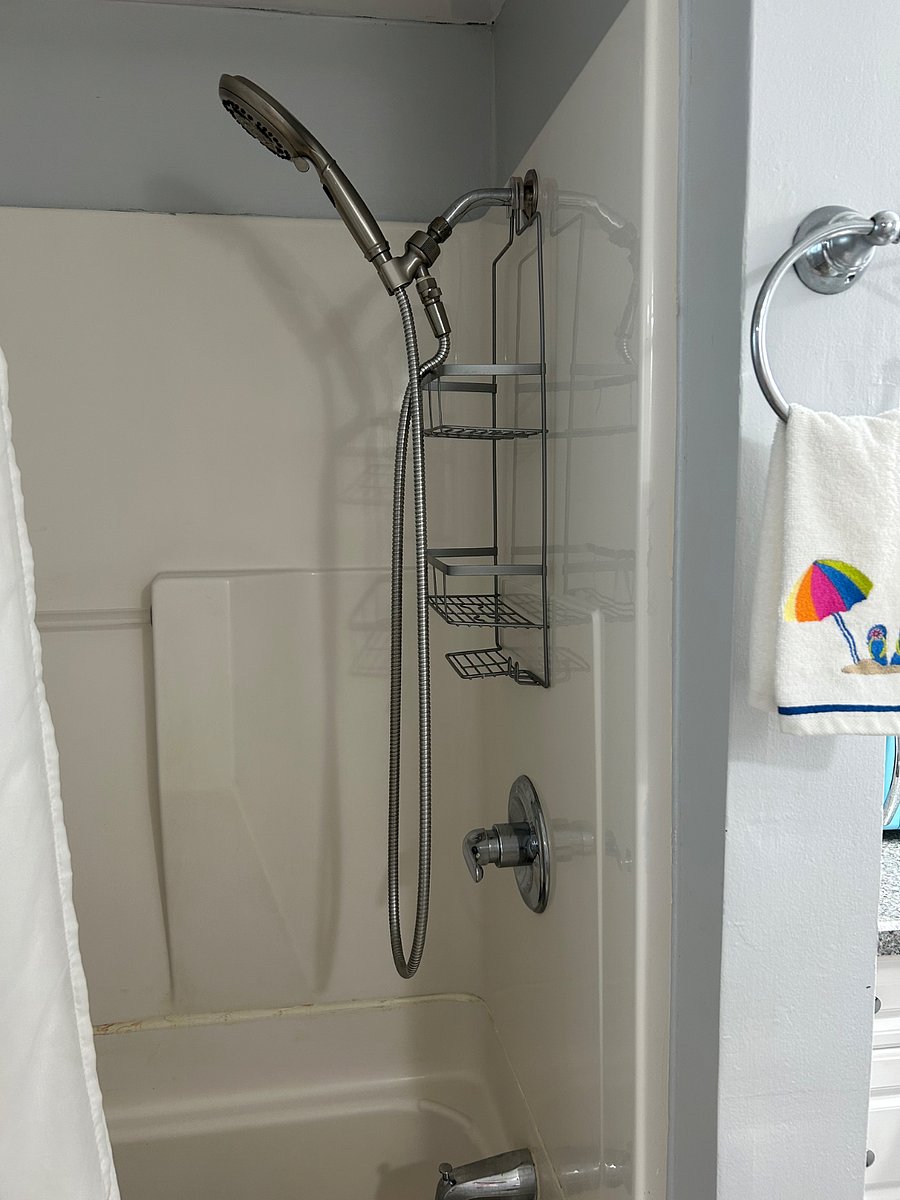 Shower/tub with safety handle.