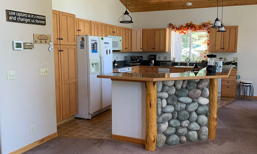 Kitchen connected to dining room and living room.