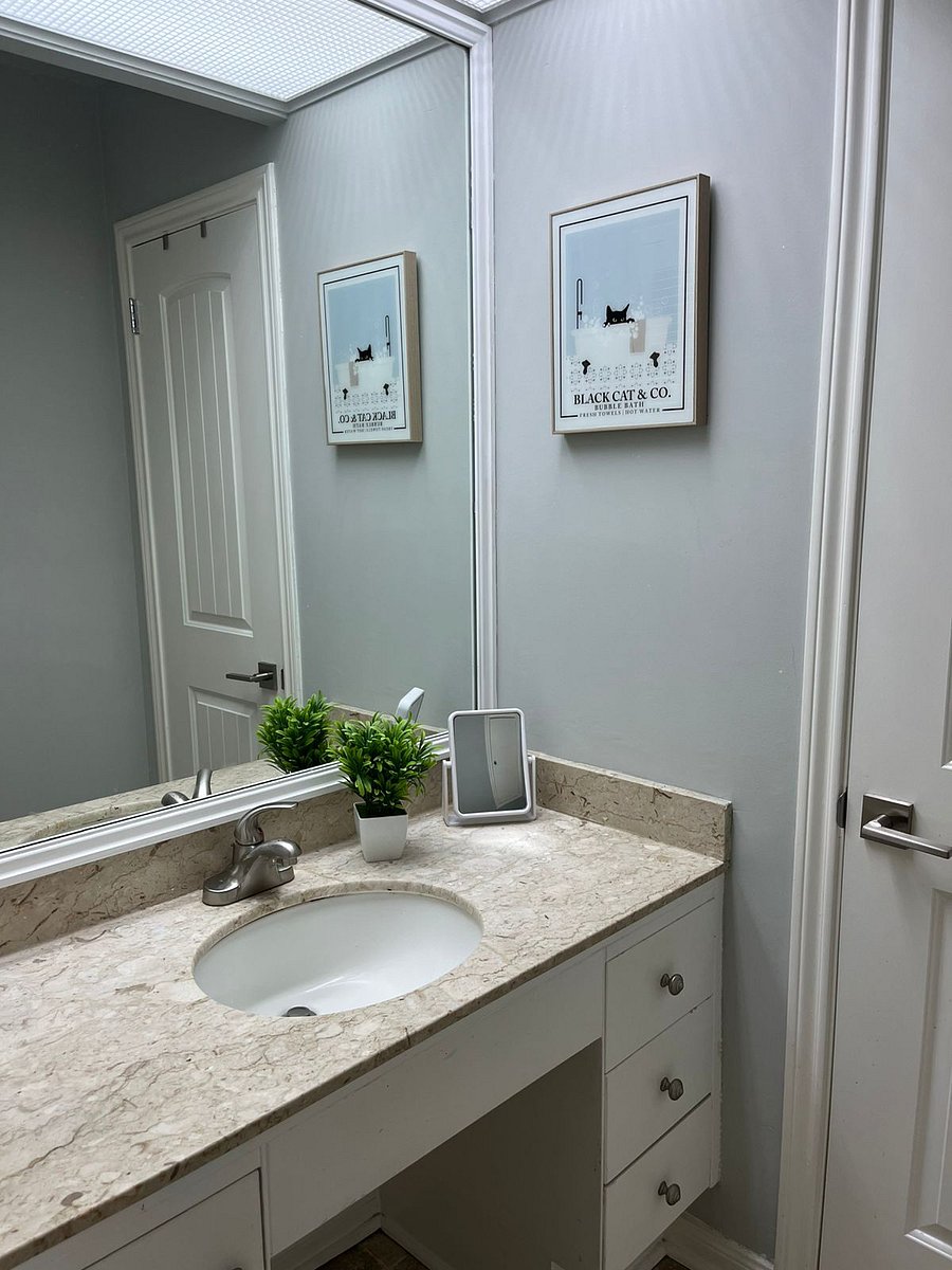 Shared guest bathroom with tub and shower