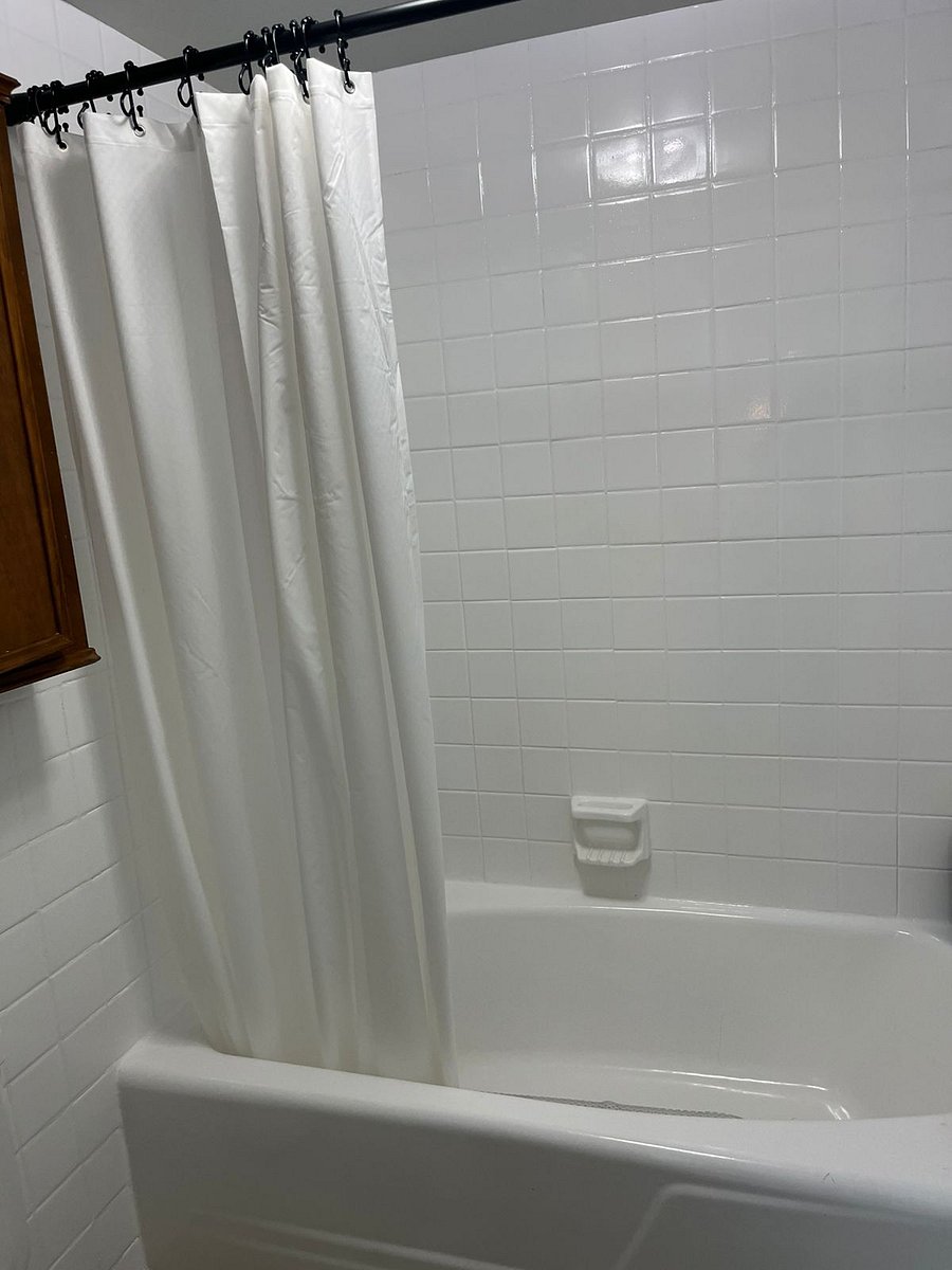 Shared guest bathroom with tub and shower