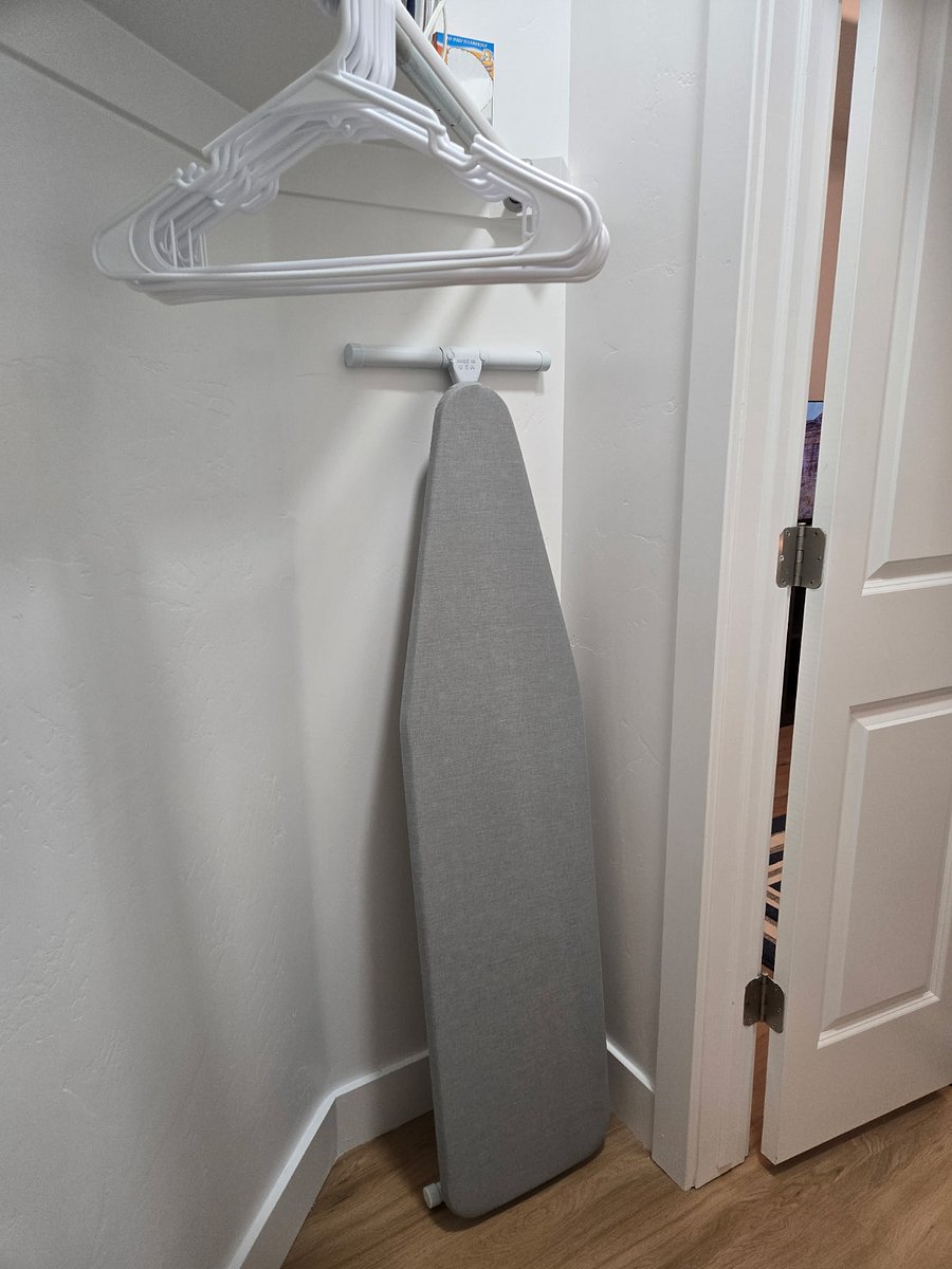 Walk-in closet with Ironing board and iron
