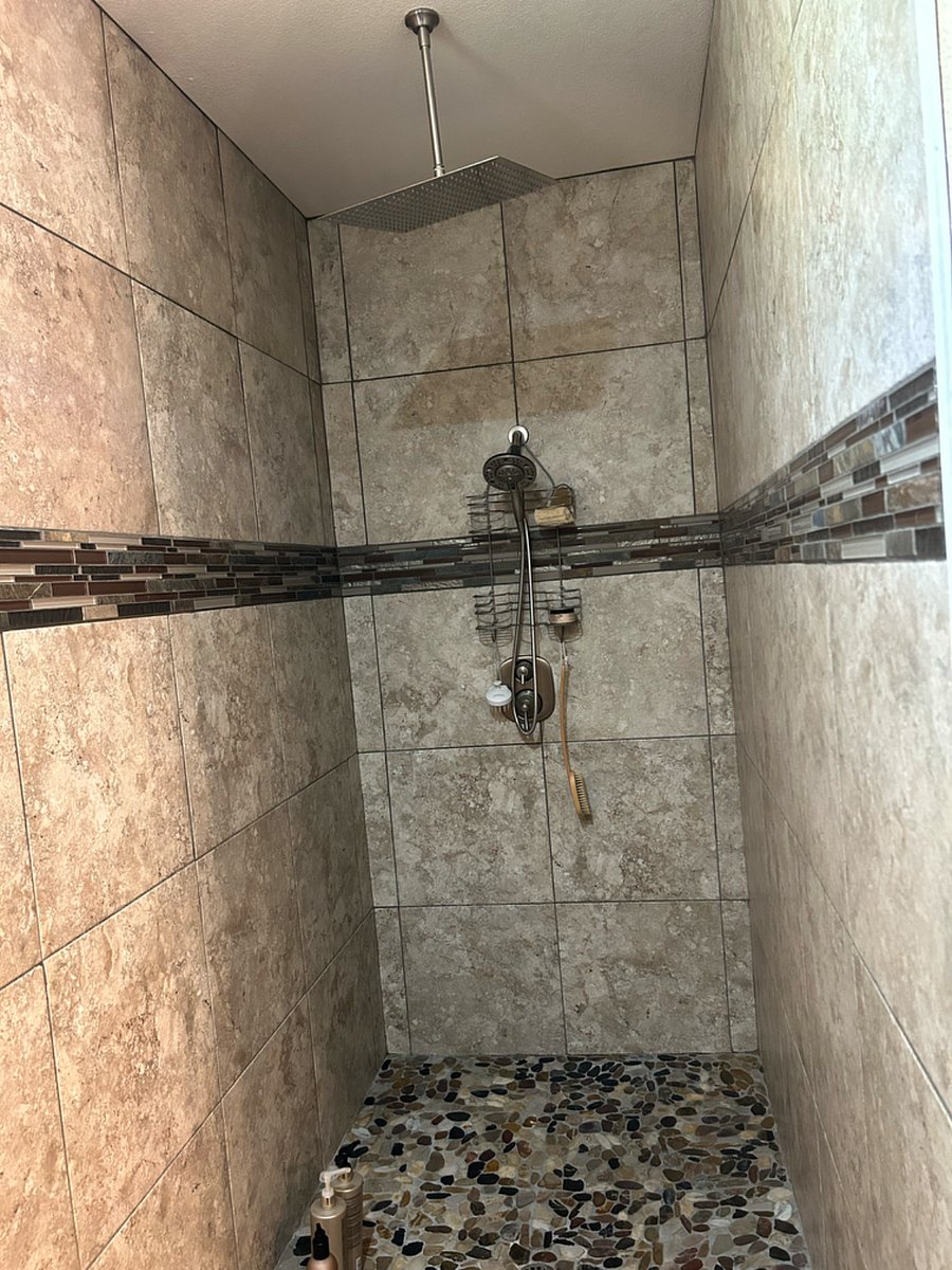 Master walk-in shower is huge with rain shower option or wand shower option