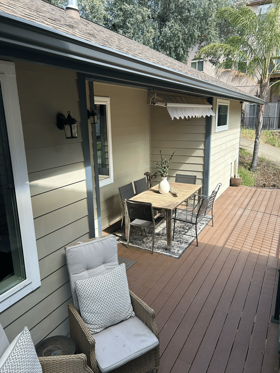 Front porch with sunshade and extendable teak table and chairs