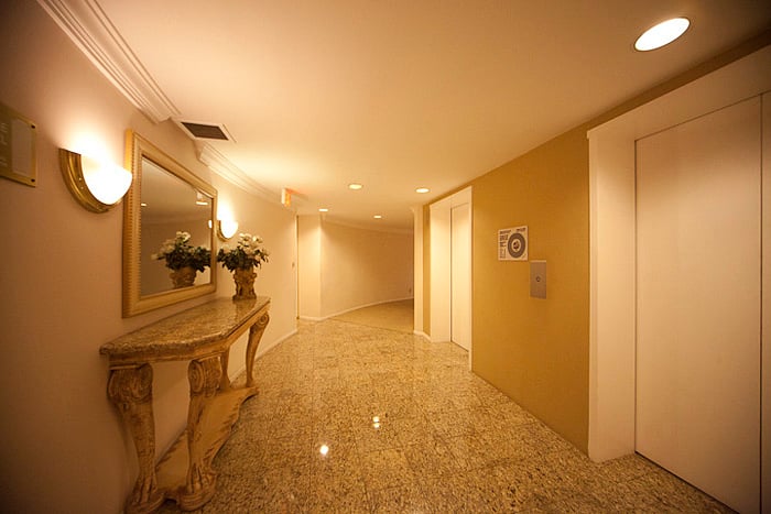 Hallway between the elevators and the condo