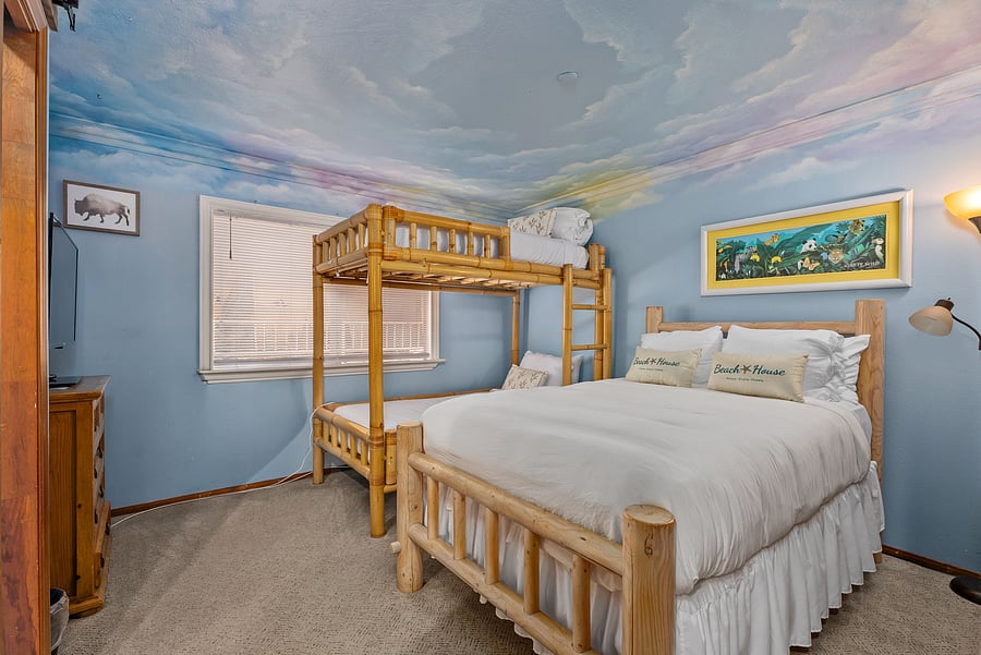 Bedroom #3 with full bed and bunk beds.