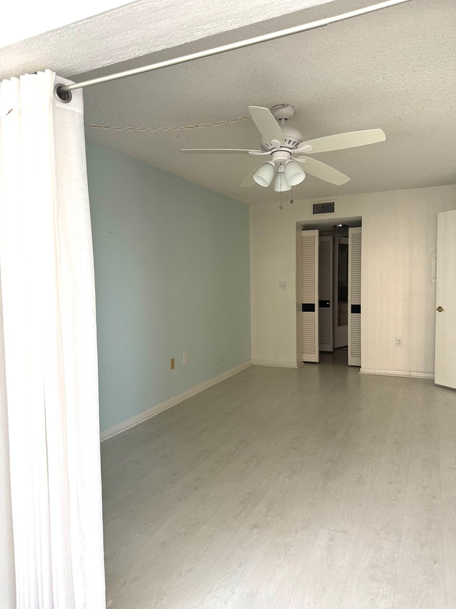 Bedroom, ceiling fan, walkway to closet and bathroom