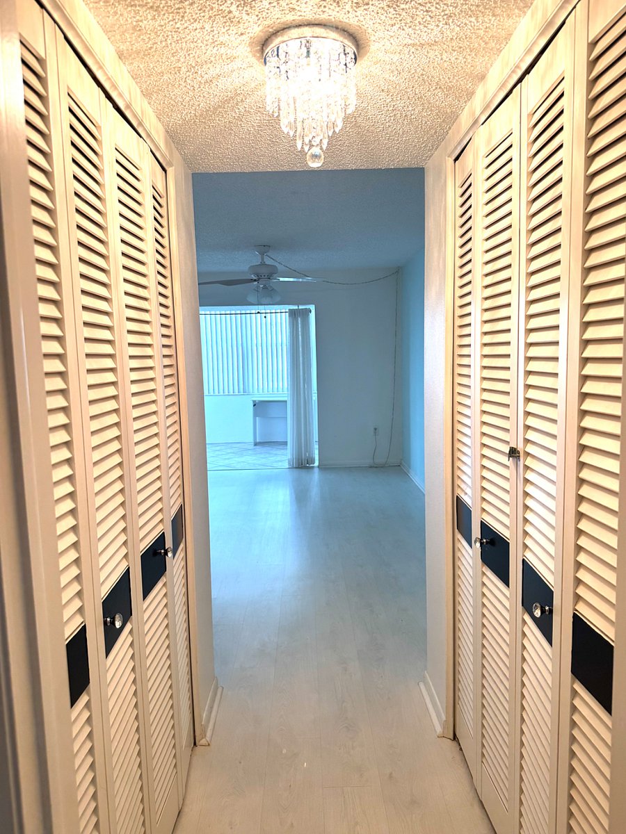 Two closets, one on right and one walk in on left