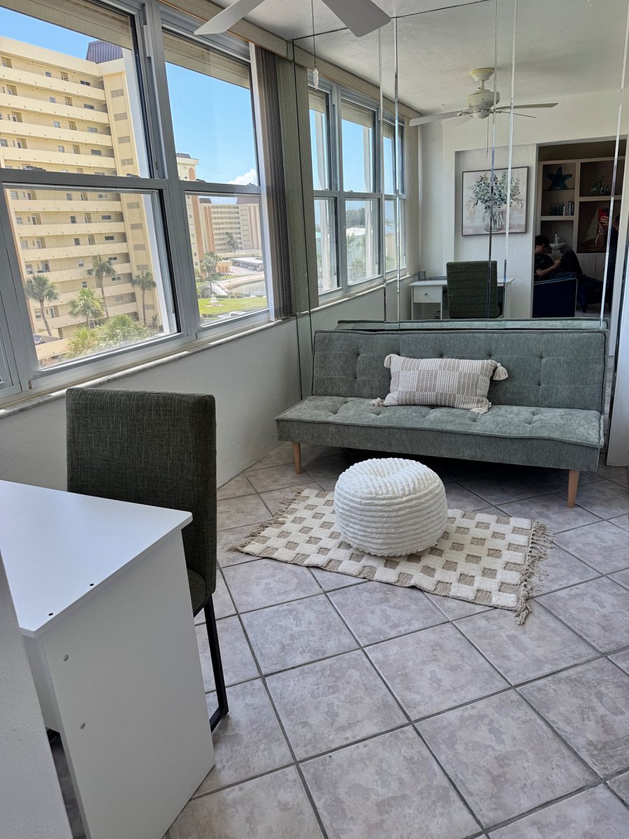 Sunroom with desk and futon
