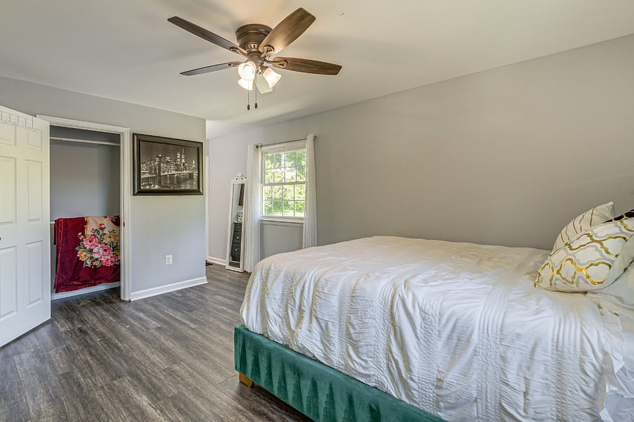 Spacious Bedroom 1 with a luxurious king bed and plenty of room to relax.