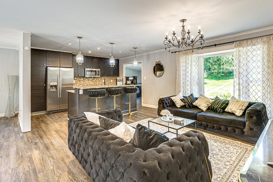Living Room-Experience comfort in style with an 85 TV and exclusive black furniture