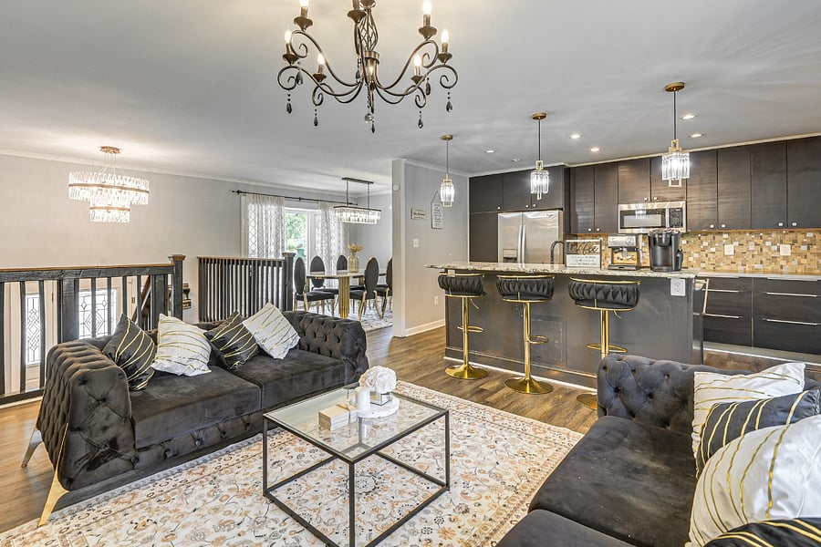 Living Room-Experience comfort in style with an 85 TV and exclusive black furniture