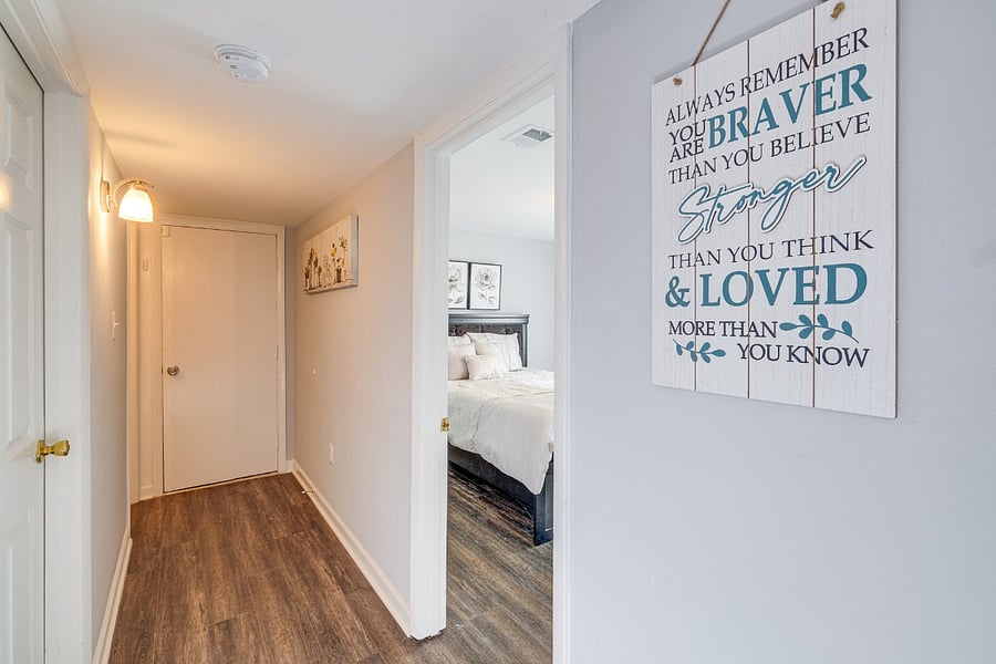 Comfortable Bedroom 4 in the basement with a bright and welcoming street view