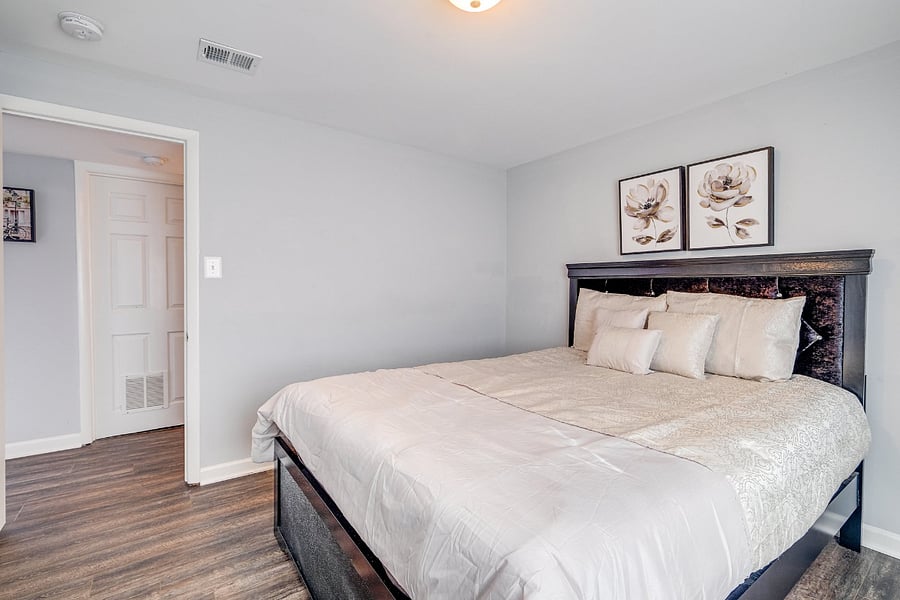 Comfortable Bedroom 4 in the basement with a bright and welcoming street view