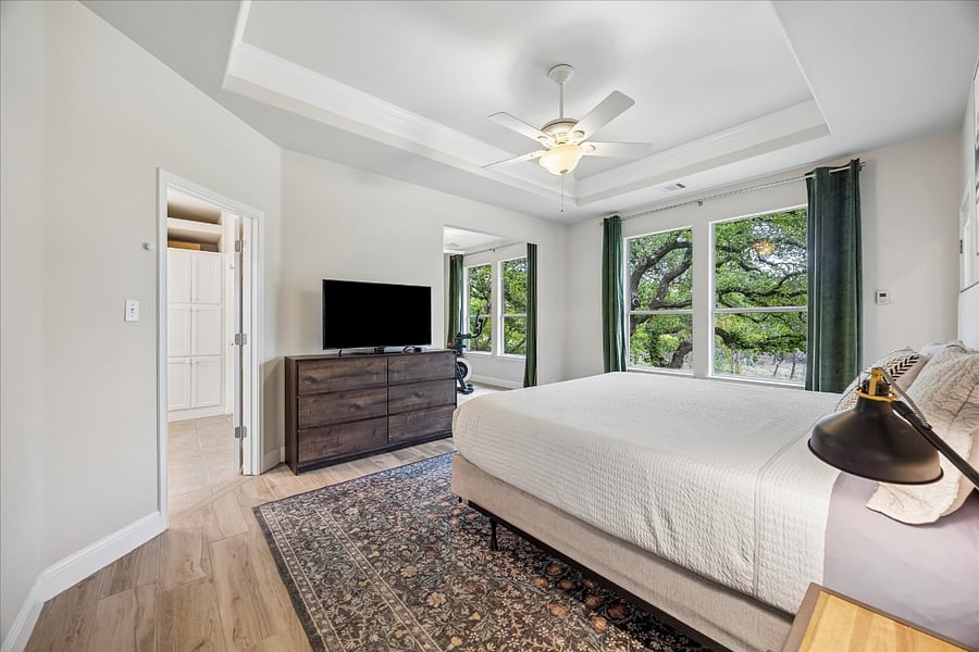 Master bedroom with fabulous nature views and blackout curtains to help you enjoy your beauty sleep!