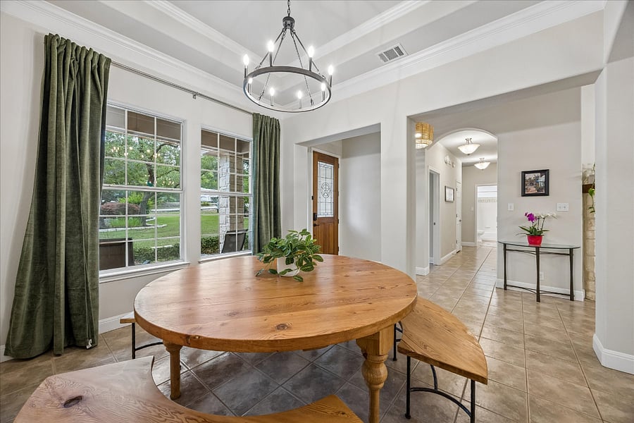 Big large dining table! Perfect for dinners together that overlook the beautiful front yard!