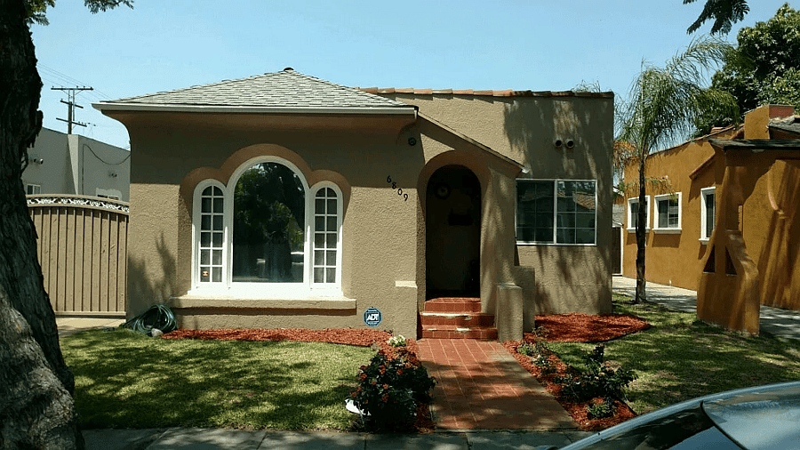 Front of home charming Spanish-style bungalow