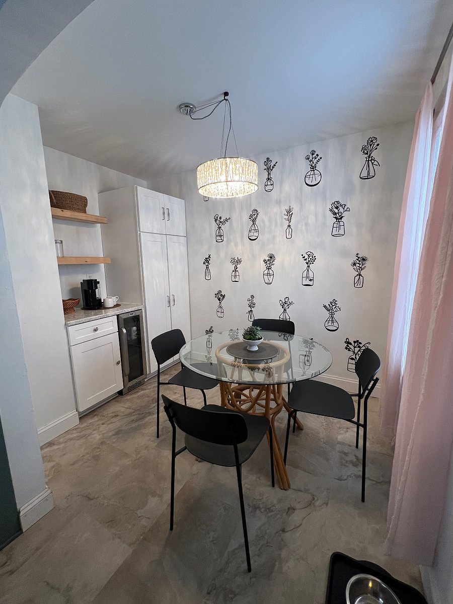 Dining Room featuring a full coffee/drink bar, mini fridge and abundant pull out drawers for storage