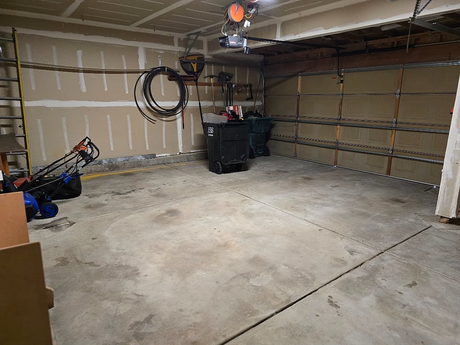 GARAGE WITH LAWN MOWER AND SNOW BLOWER