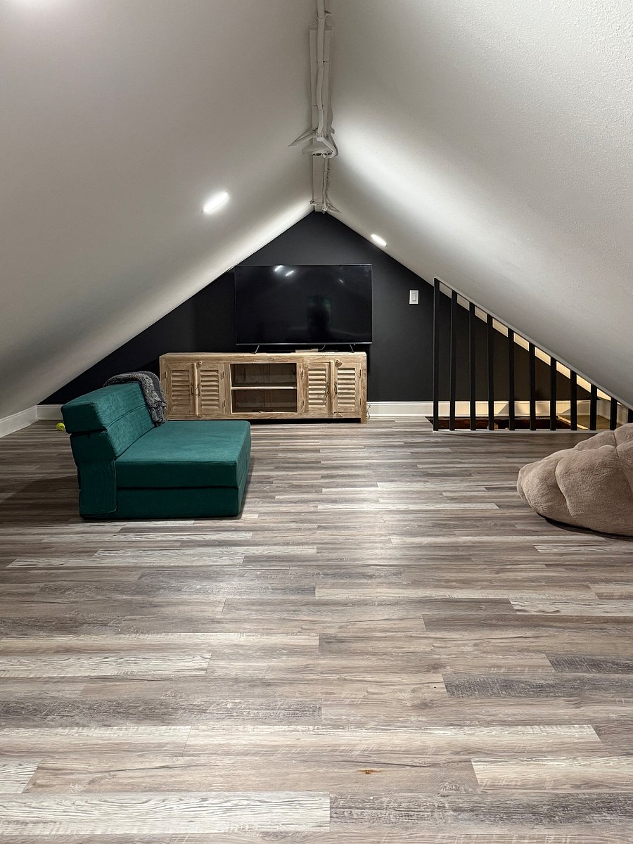 HUGE lofted room used as a 3rd bedroom + TV room. Low ceiling