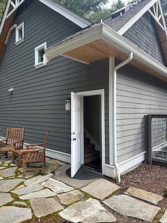 Rear entrance to apartment with secluded outside sitting area
