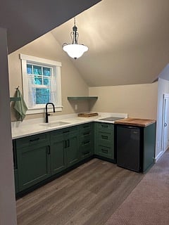 Kitchenette with new appliances, including small refrigerator