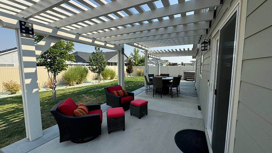 Padded furniture and high-top table with fire pit.