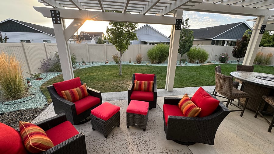 Padded furniture and high-top table with fire pit.